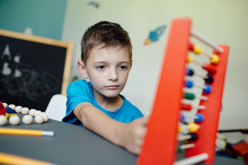 schoolboy-learning-maths-with-an-abacus-2021-08-26-20-15-04-utc